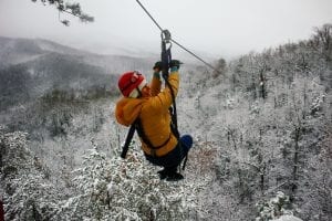 woman ziplining in the winter